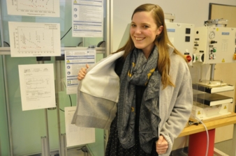Project team member Susanne Aumann presents the stab protection cardigan in the laboratory at the Research Institute for Textiles and Clothing Phot...