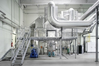 A flue gas scrubber cleans the flue gases from the recycled,oil-fired boiler